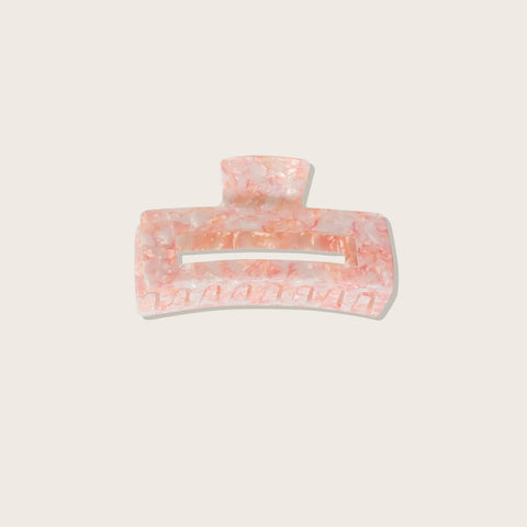 Pince à griffe rose Pixie Woo pour cheveux, outil de coiffure avec mâchoires solides et design élégant.