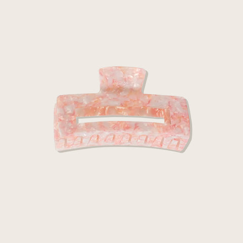 Pince à griffe rose Pixie Woo pour cheveux, avec des dents larges, adaptée pour coiffer et maintenir les cheveux en place.
