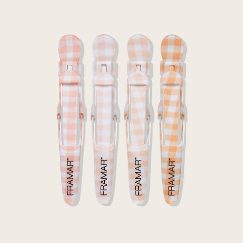 Pinces Gator Grips Peach Please de Framar pour coiffure professionnelle, en acier robuste, au design ergonomique.