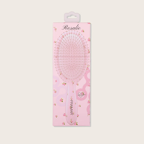 Brosse démêlante Framar Rosalie en plastique violet avec poils flexibles pour démêler les cheveux en douceur.