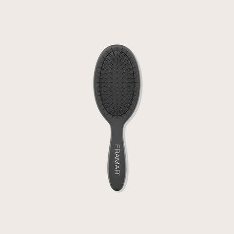 Mini brosse démêlante noire Framar, outil de coiffure compact pour démêler facilement les cheveux.
