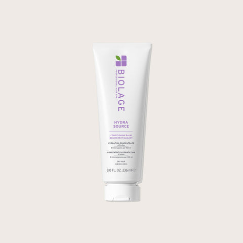 Baume revitalisant Hydrasource de Biolage pour cheveux, texture crémeuse, dans un flacon de 236 ml, visible en image.