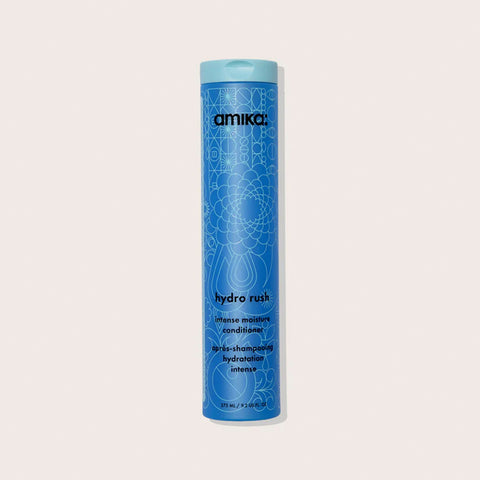 Revitalisant hydratant pour cheveux Amika Hydro Rush, flacon blanc avec étiquette bleue, visible en image.