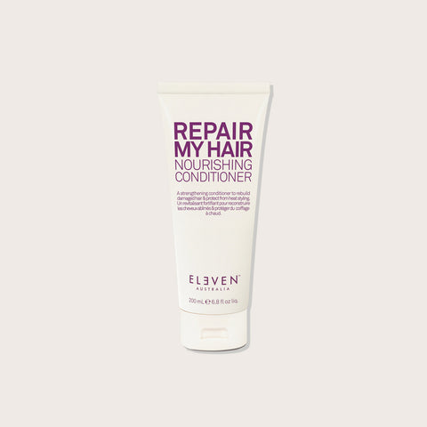 Revitalisant pour cheveux Eleven Australia Repair My Hair, bouteille verte avec bouchon noir, visible sur l'image.