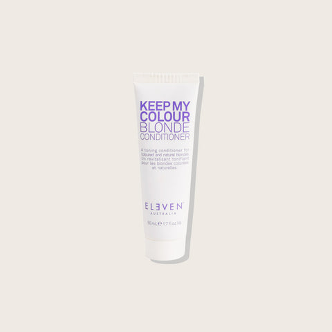 Revitalisant pour cheveux blonds Eleven Australia Keep My Blonde, texture crémeuse et flacon blanc avec étiquette verte.