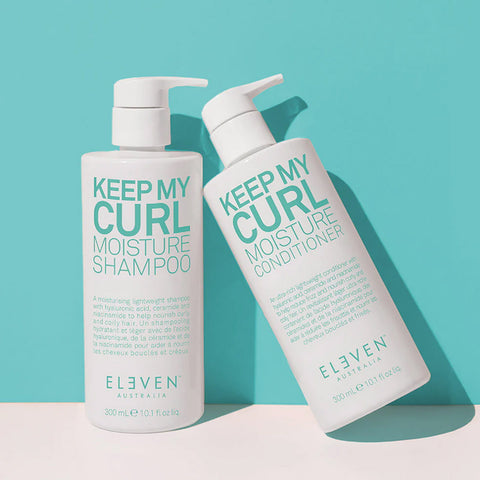 Revitalisant boucles Keep My Curl de Eleven Australia pour cheveux bouclés, flacon de 300 ml posé sur une surface.