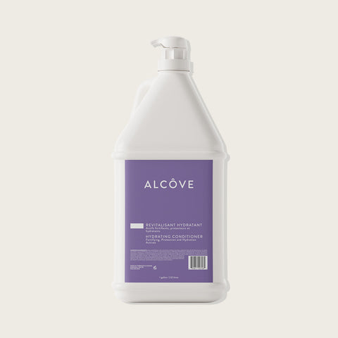 Bain de cheveux revitalisant hydratant Alcôve, texture crémeuse et flacon élégant pour cheveux en bonne santé.