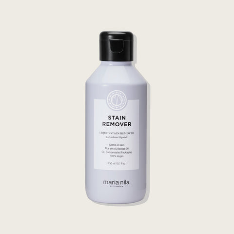 Détachant liquide Maria Nila pour enlever les taches, flacon de 150 ml, visible avec packaging blanc et étiquette.