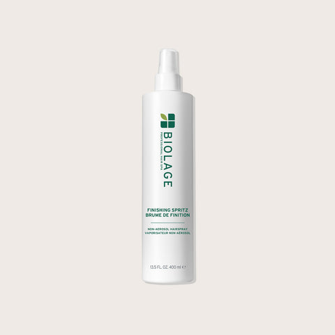 Brume de finition Biolage pour cheveux, spray léger de 400 ml pour une touche de brillance et de tenue naturelle.
