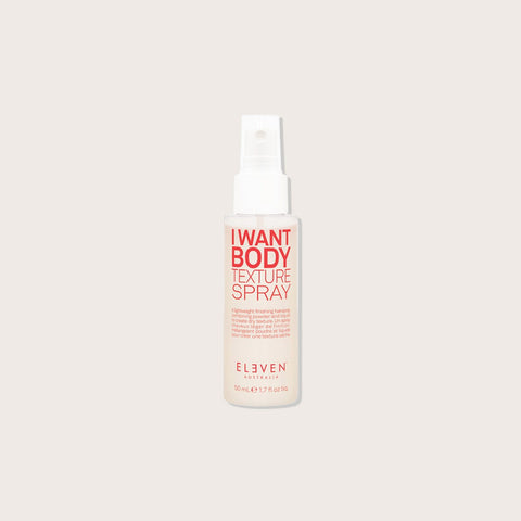 Spray volume Eleven Australia I Want Body pour cheveux, flacon en spray avec étiquette colorée et texture légère.