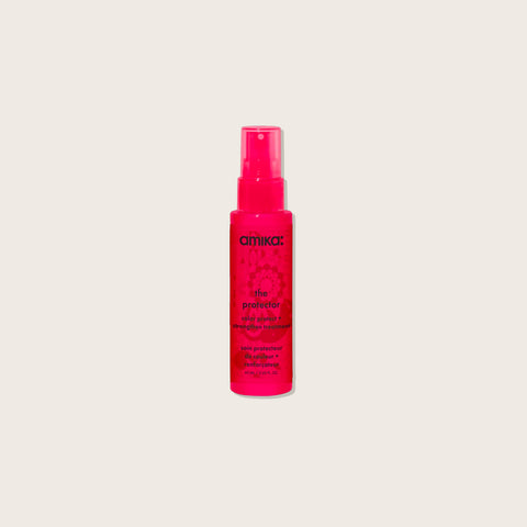 Spray sans rinçage Amika The Protector pour cheveux colorés, renforçant et protégeant la couleur.