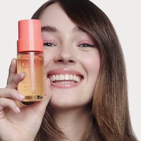 Huile miracle pour cheveux Eleven Australia dans un flacon de 100 ml, soin capillaire brillant et nourrissant.