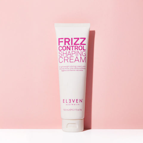 Crème coiffante Eleven Australia Frizz Control pour cheveux, tube de 150 ml, texture lisse et anti-frisottis visible dans l'image.