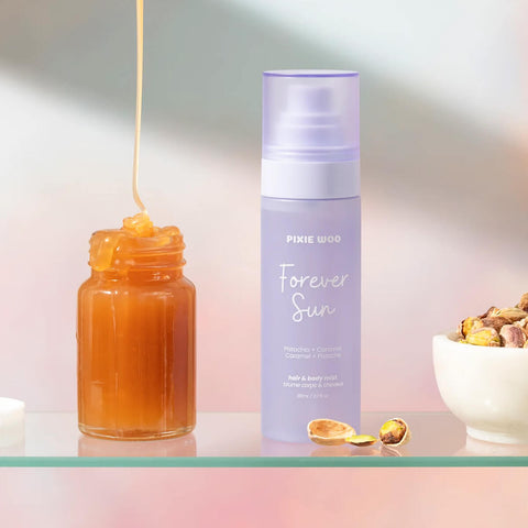 Brume pour cheveux et corps Pixie Woo Forever Sun, vaporisateur de 100 ml, contenant une formule hydratante et rafraîchissante.