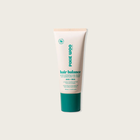 Exfoliant pour cuir chevelu Pixie Woo, soin capillaire en flacon de 130 ml, avec texture exfoliante visible dans l'image.