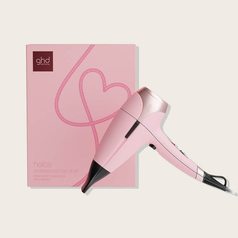 Sèche-cheveux GHD Helios Édition Limitée en rose, outil de coiffage professionnel avec design élégant et technologie avancée.
