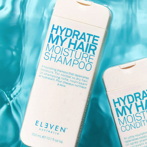 Shampooing hydratant pour cheveux de la marque Eleven Australia, texture crémeuse et bouteille élégante visible dans l'image.