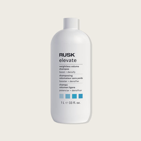 Shampooing Rusk Volume Elevate pour cheveux légers et volumineux, bouteille blanche avec logo Rusk visible.