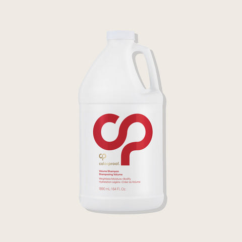 Shampooing volume Colorproof pour cheveux, flacon de 250 ml, avec étiquette blanche et logo coloré.