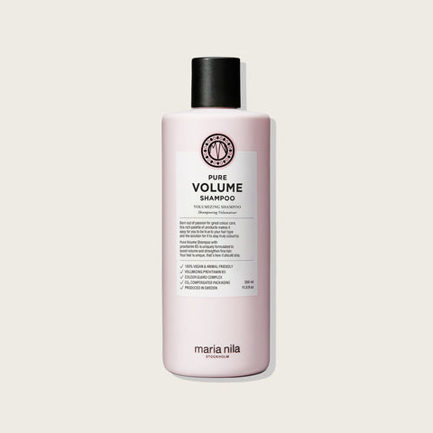 Shampooing volumisant Maria Nila Pure Volume pour cheveux, bouteille blanche avec étiquette colorée, vue de face