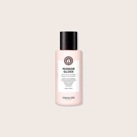 Shampooing Maria Nila Mirror Gloss pour cheveux, bouteille blanche avec logo, éclat brillant et soin capillaire.