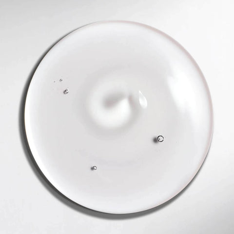 Shampooing professionnel Wella Professionals Ultimate Smooth pour cheveux lisses et soyeux, 250 ml dans un flacon élégant.