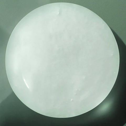 Shampoing volumisant Biolage Volume Boost pour cheveux, bouteille d’un litre, texture moussante et effet volumisant visible.