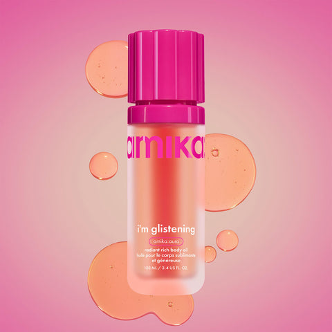 Huile pour le corps Amika I'm Glistening, flacon de 100 ml avec texture brillante et application facile, pour une peau éclatante.