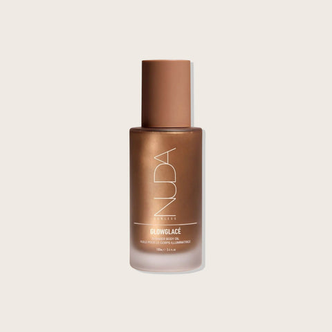 Huile sèche scintillante Nuda GlowGlacé pour les ongles, bouteille de 100 ml, finition brillante et hydratante.