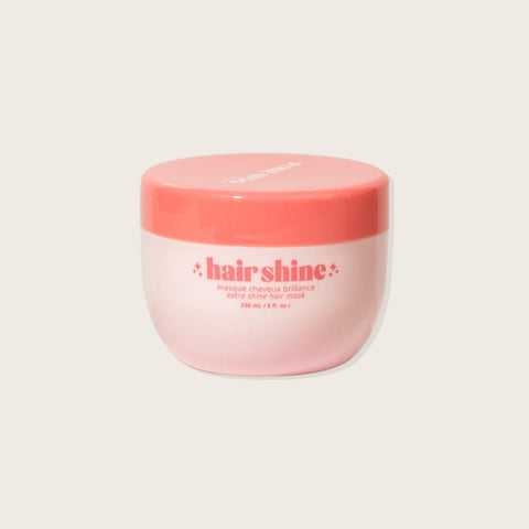 Masque capillaire Pixie Woo pour brillance, contenant 238 ml, montre un pot de soin capillaire pour cheveux lumineux.