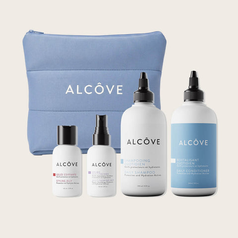Coffret de soins capillaires Alcôve Routine Quotidien pour cheveux, contenant plusieurs produits dans une boîte festive.