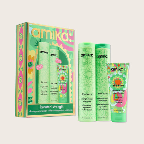 Coffret de fêtes Amika pour cheveux, comprenant des produits de soin capillaire Kurated Strengh Kure, avec packaging élégant.