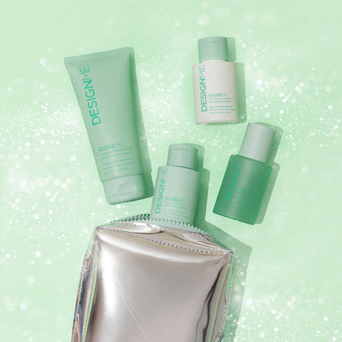 Coffret de fêtes DESIGN.ME GLOSS.ME pour cheveux, comprenant des produits de soin capillaire, avec emballage festif.