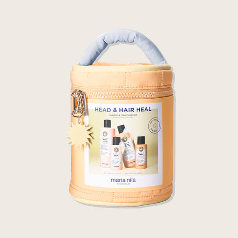 Trousse de beauté Maria Nila Head & Hair Heal avec produits capillaires pour soin des cheveux, dans une trousse élégante.