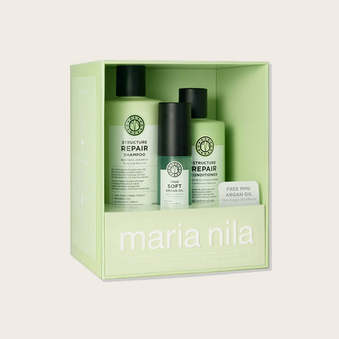 Coffret de fêtes Maria Nila Structure Repair pour cheveux, contenant des produits capillaires pour réparer et renforcer les cheveux.